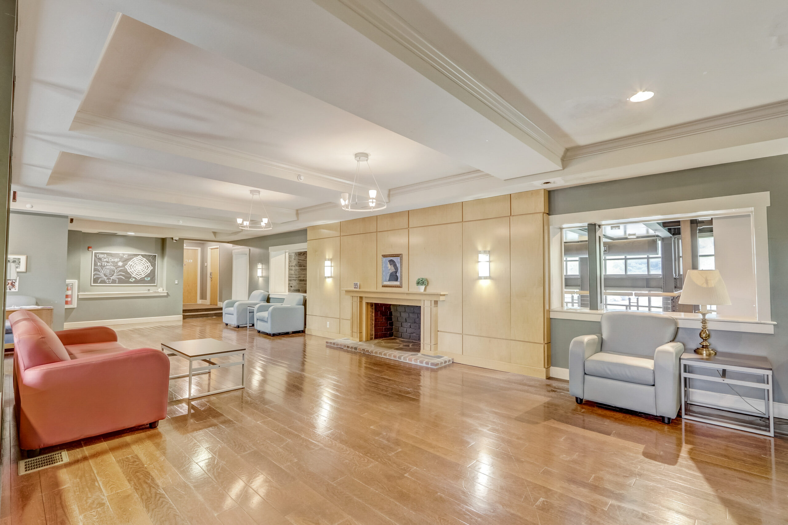 The Connelly Residence Hall foyer entrance with fire place part of why Rosemont College is Forbes rated best online college, and a best mainline college.