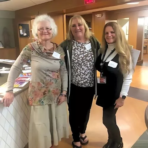 Diverse generations of alumnae in the library to represent how alumni are part of why Rosemont College is a Forbes rated best online college, and a best Main Line college.