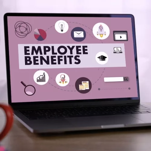 Laptop with a screen displaying Employee Benefits to represent how employees are part of why Rosemont College is a Forbes rated best online college, and a best Main Line college.