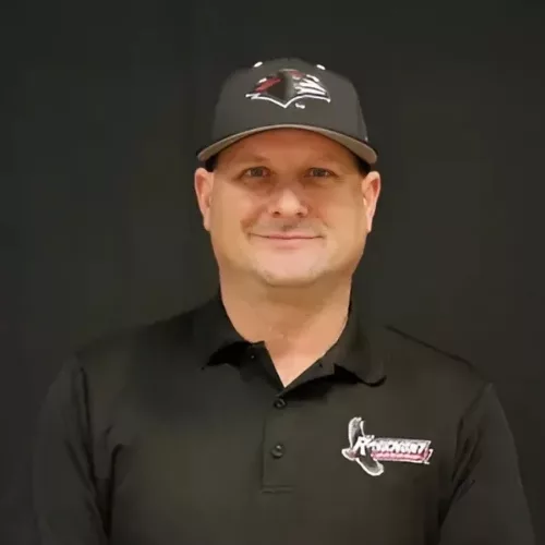 Close up of Ross Trachtenberg in a Rosemont College baseball hat and shirt to represent how Rosemont College is a Forbes rated best online college, and a best Main Line college.