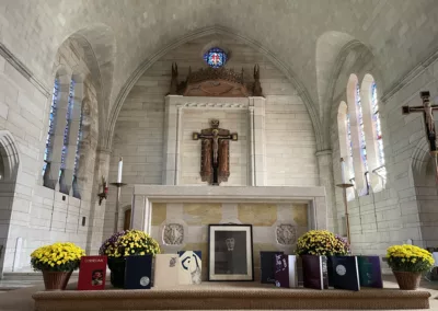 Reunion mass with display of of Cornelian Yearbooks to represent how Rosemont College is a Forbes rated best online college, and a best Main Line college.