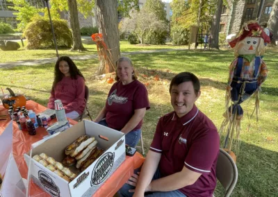 Oktoberfest 2025 ministry table to represent how Rosemont College is a Forbes rated best online college, and a best Main Line college.