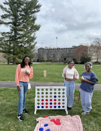 Connect Four game on Connelly Green for Spring Festival 2025 to represent how Student Engagement events are part of why Rosemont College is a Forbes rated best online college, and a best Main Line college.