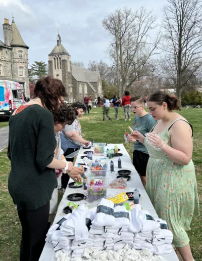 Students on Connelly Green for Spring Festival 2025 to represent how Student Engagement events are part of why Rosemont College is a Forbes rated best online college, and a best Main Line college.
