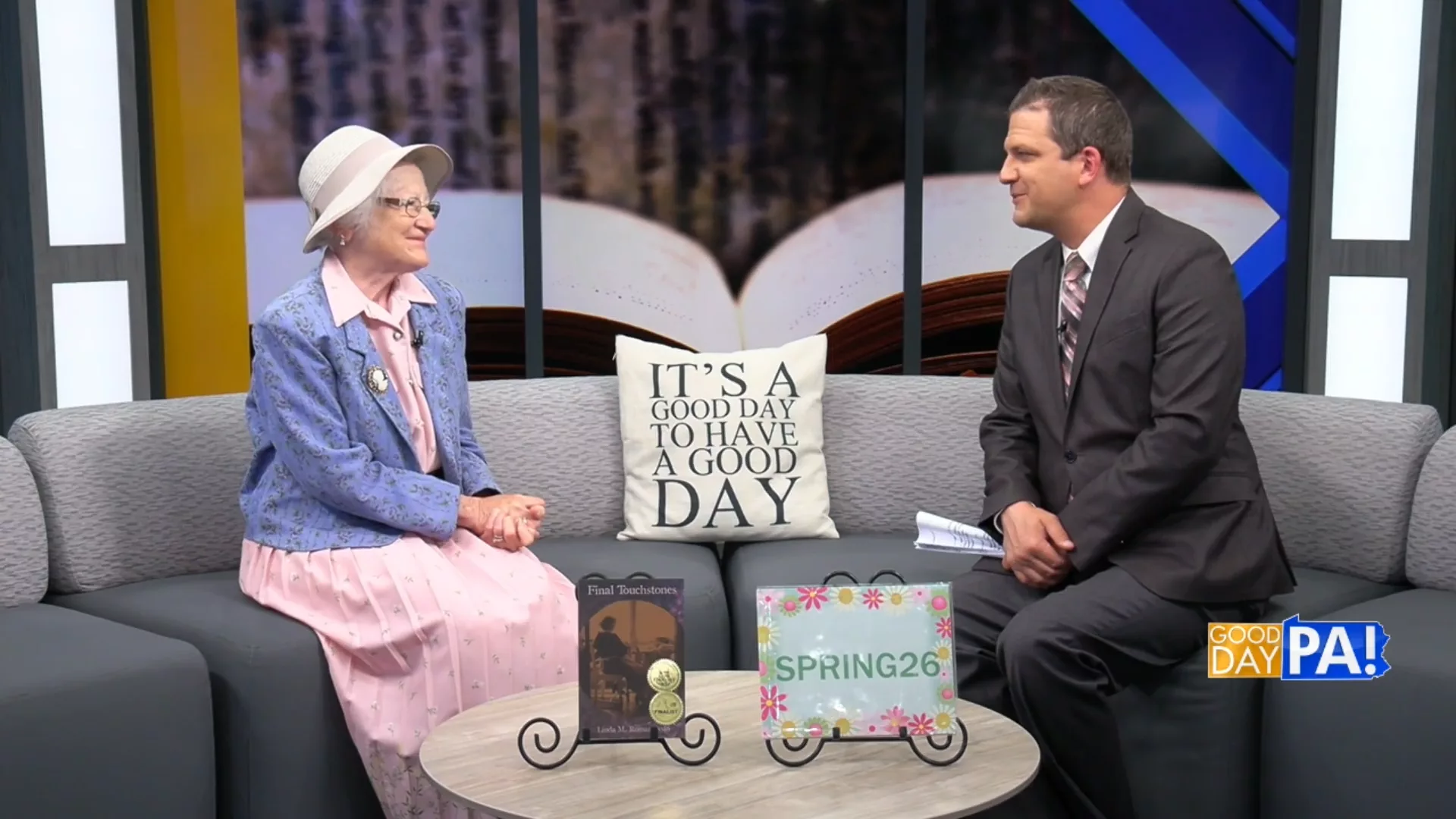Photo of ABC - Good Morning PA host Brett Thackara interviewing award winning author Linda Romanowski to represent how alumnae are a part of why Rosemont College is a Forbes rated best online college, and a best Main Line college.