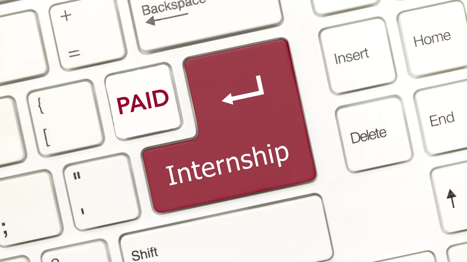 A close up of a keyboard showing a Paid button next to an Internship button to represent how Career Services is a part of why Rosemont College is a Forbes rated best online college, and a best Main Line college.